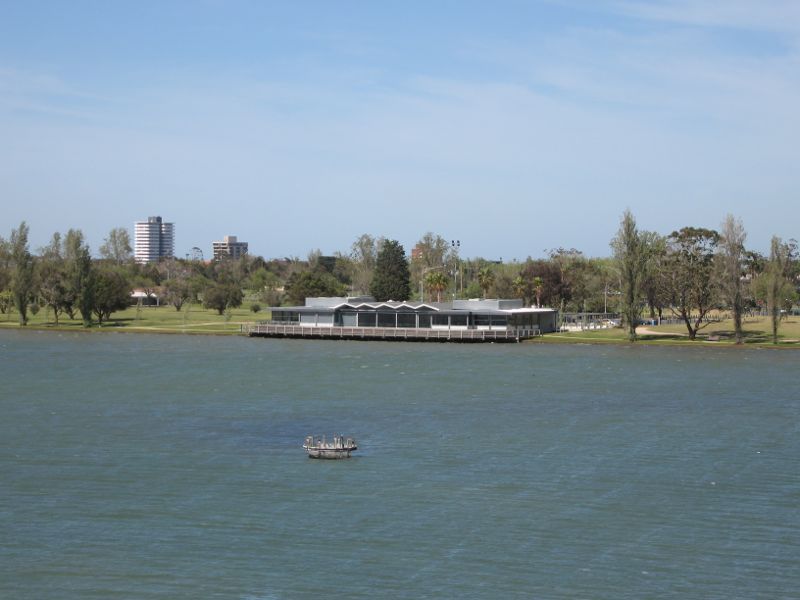 Albert Park - Albert Park Lake, jetties along Aquatic Drive and 'The Point': View south towards Carousel Function Centre from 'The Point' lookout