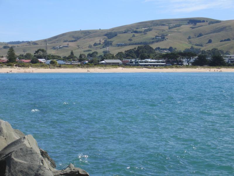 Apollo Bay - Boat Harbour, wharf and breakwater: View west from wharf towards beach and town centre