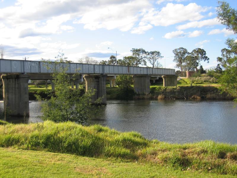 Bairnsdale - Mitchell River, just south of Princes Highway: View east across Mitchell River at old railway bridge