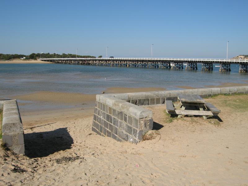 Barwon Heads - Frank Ellis Reserve, Barwon River coastline along Flinders Parade: View east across river towards bridge
