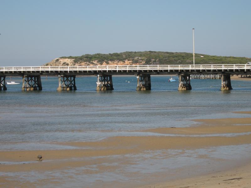 Barwon Heads - Frank Ellis Reserve, Barwon River coastline along Flinders Parade: View towards bridge and The Bluff