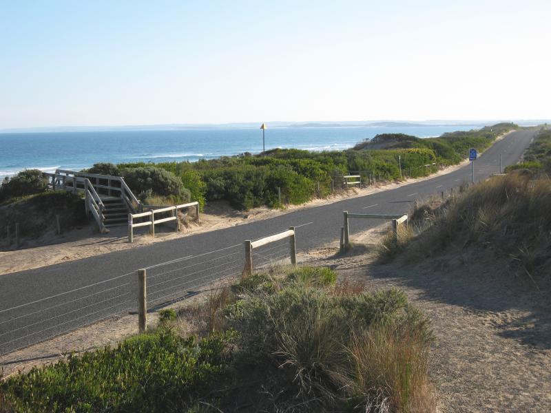 Barwon Heads - Thirteenth Beach fronting Bass Strait: View west along 13th Beach Rd at SLSC