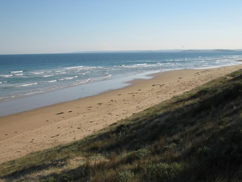 Barwon Heads - Thirteenth Beach fronting Bass Strait: View west along beach at SLSC