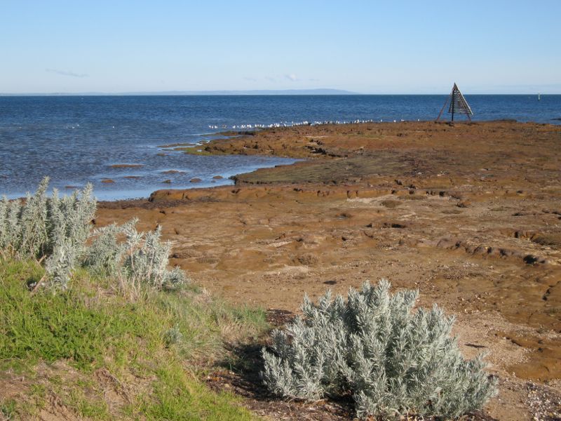 Beaumaris - Beach between Beaumaris Yacht Club and Ricketts Point: View across rock platform towards navigation marker at Ricketts Point