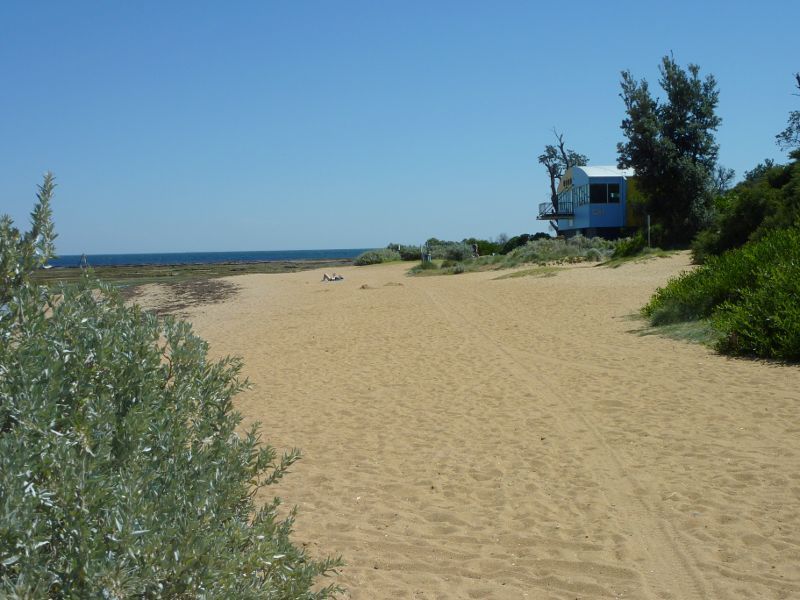 Beaumaris - Beach and cliff top path near Beaumaris Life Saving Club: View west along beach towards Beaumaris Life Saving Club