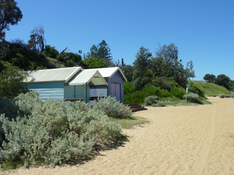Beaumaris - Beach and cliff top path near Beaumaris Life Saving Club: Bathing boxes on beach