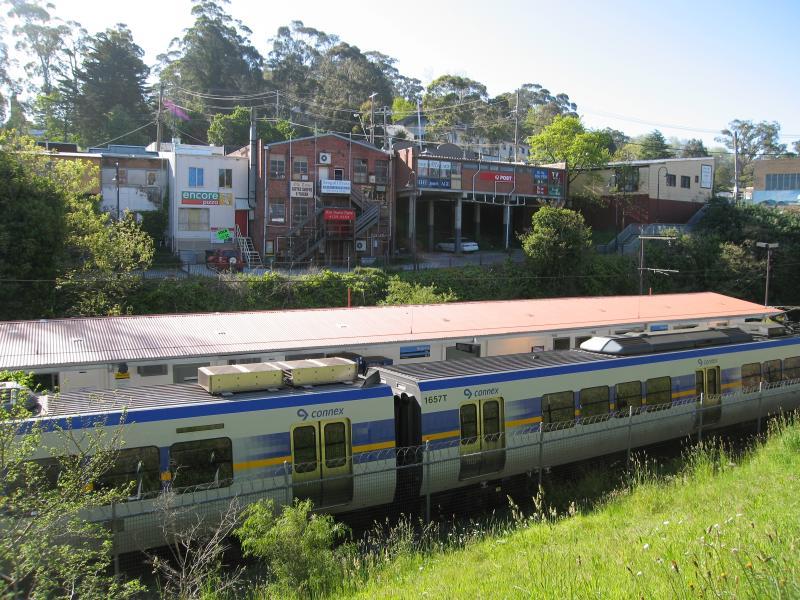 Belgrave - Belgrave railway station, south side of Bayview Road: View north-west across station towards back of shops on Main St