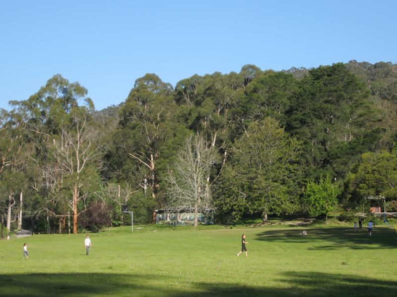 Belgrave - Belgrave Lake Park: View across central oval towards basketball court and toilets