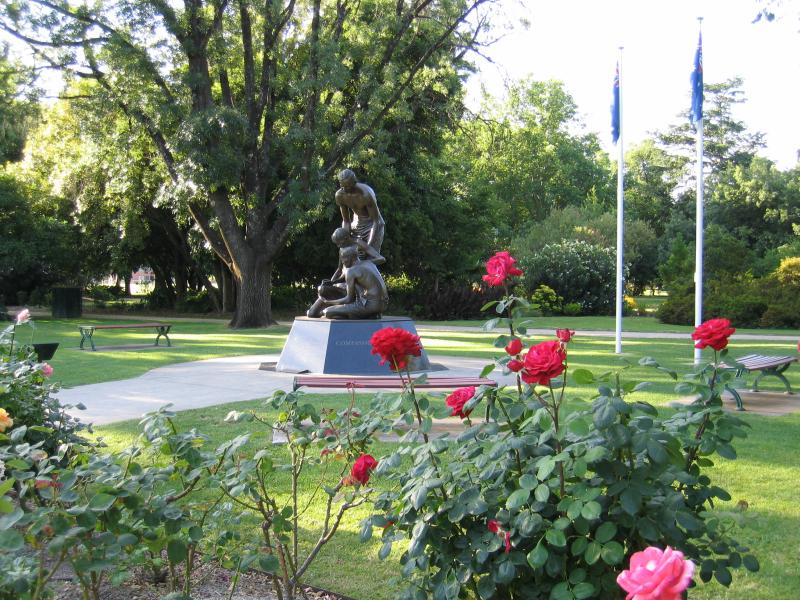 Benalla - Botanical Gardens, Bridge Street West: Roses with Weary Dunlop memorial in background