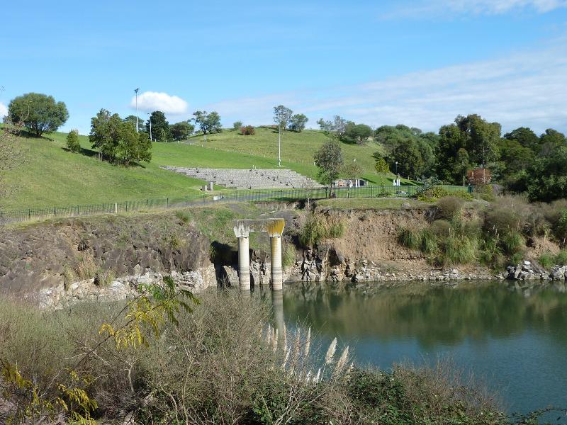 Berwick - Wilson Botanic Park: View across Anniversary Lake towards crushing plant pylon and amphitheatre