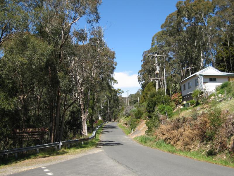 Blackwood - Mineral Springs Reserve at Lerderderg River, Golden Point Road: View east along Golden Point Rd at access road to mineral springs