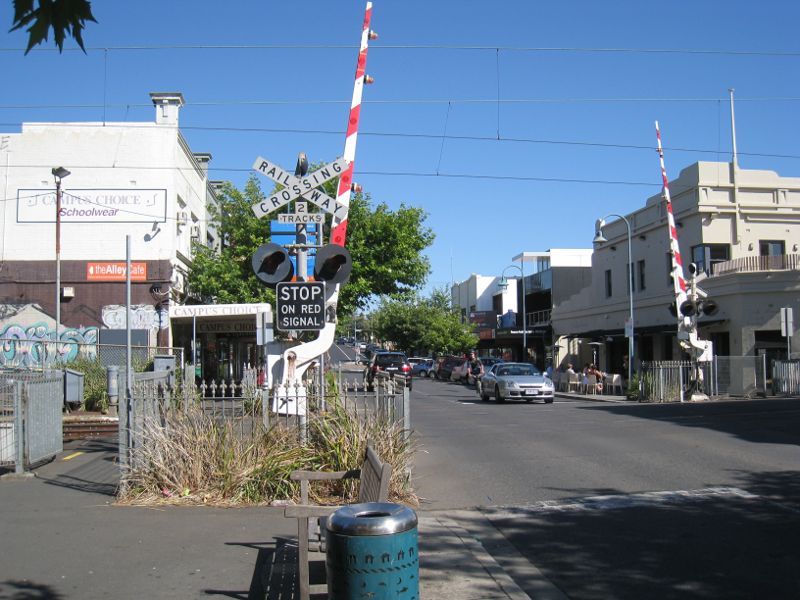Brighton - Shops along Church Street: View south-east along Church St at railway crossing