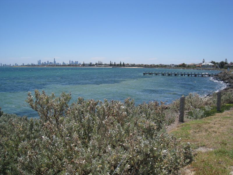 Brighton - Beach and coastline between North Road and Middle Brighton Pier: Northerly view along coast towards jetty and city skyline