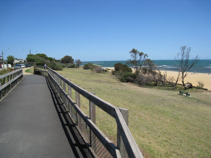 Brighton - Beach and coastline at Middle Brighton Beach: View south along foreshore path
