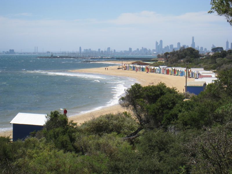 Brighton - Beach, coastline and bathing boxes at Dendy Street Beach: Northerly view over beach towards bathing boxes and city skyline