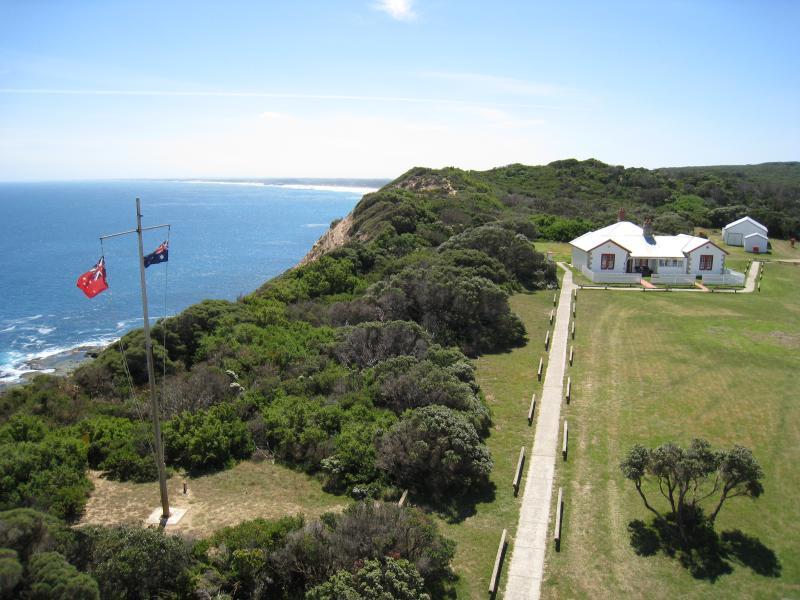 Cape Schanck - Cape Schanck Lighthouse Reserve, end of Cape Schanck Road: From top of lighthouse, view north along coast towards flag pole and museum