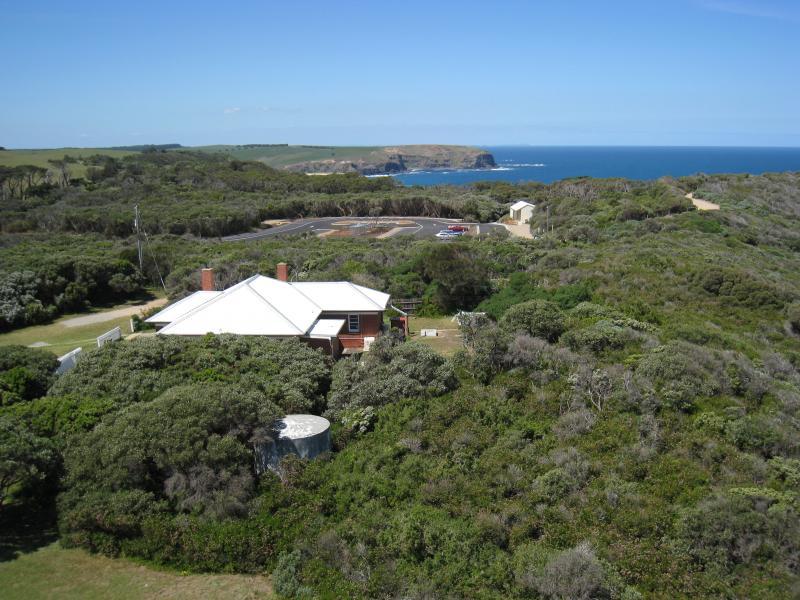 Cape Schanck - Cape Schanck Lighthouse Reserve, end of Cape Schanck Road: From top of lighthouse, view east to red lighthouse keeper's cottage