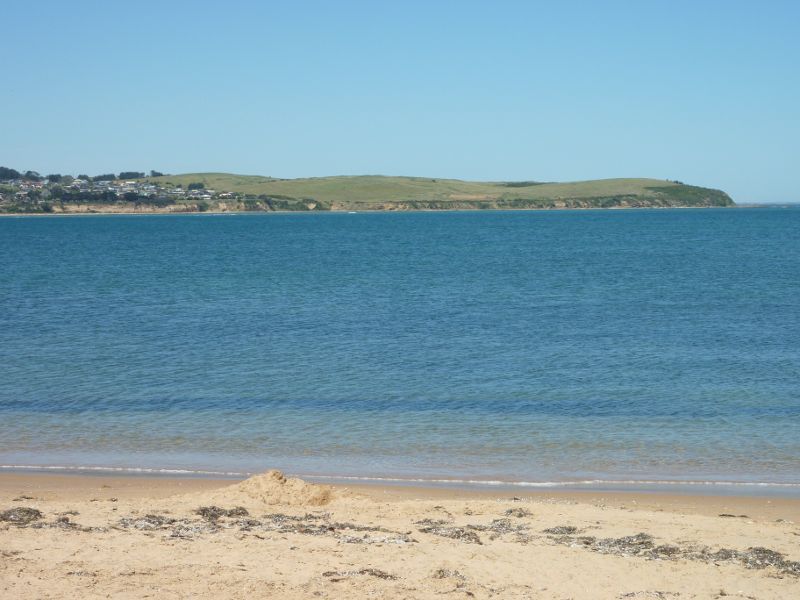 Cape Woolamai - Beach along The Esplanade near Seaspray Avenue: South-easterly view across channel towards San Remo and Griffiths Point
