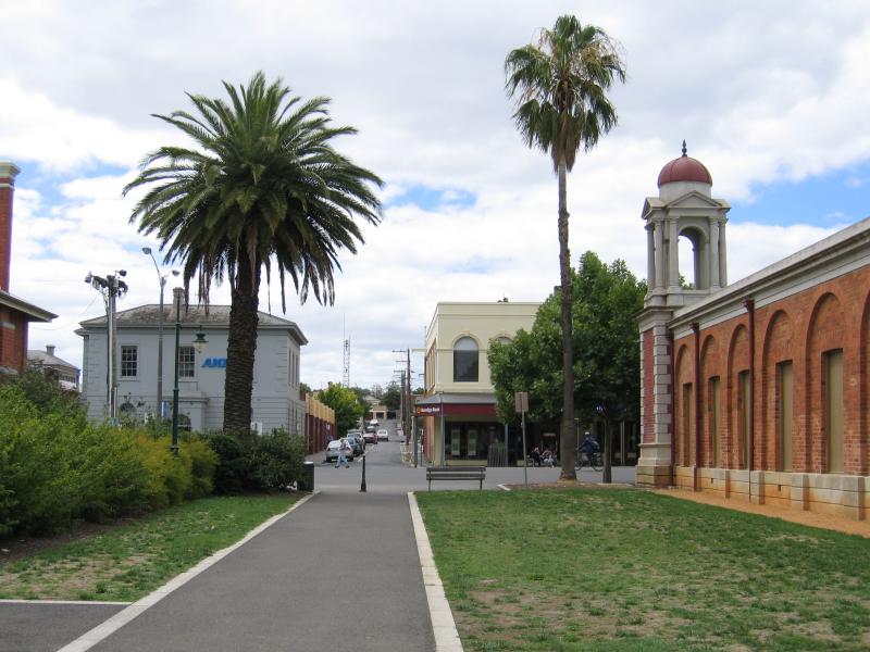Castlemaine - Shops and commercial centre along Barker, Mostyn and Lyttleton Streets: View north along pathway next to Visitor Information Centre, towards Mostyn St