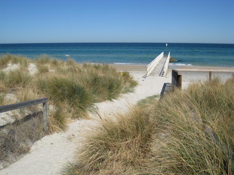 Chelsea - Beach and foreshore around pier and north of pier: View towards pier from path to beach at end of The Avenue