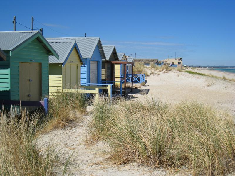 Chelsea - Beach and foreshore around pier and north of pier: Bathing boxes, view south along beach towards Chelsea Yacht Club