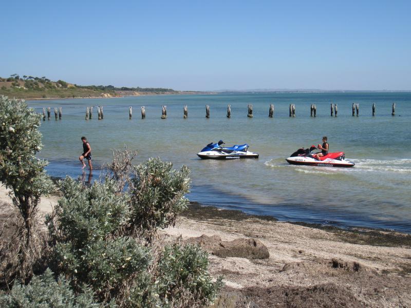 Clifton Springs - Beach near dismantled pier on western side of Clifton Springs Boat Harbour: Jet skis, view west along beach from near boat harbour