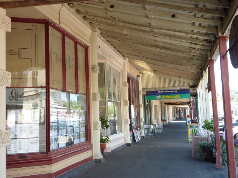 Clunes - Shops and commercial centre, Fraser Street between Service Street and Templeton Street: View east under shop verandahs along northern side of Fraser St