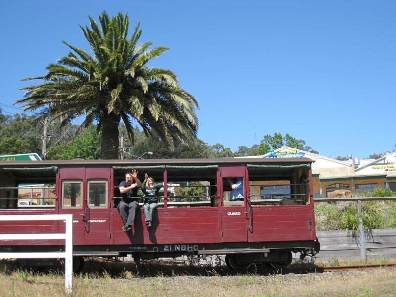 Cockatoo - Puffing Billy stream train through Cockatoo: Puffing Billy carriage viewed from Pakenham Rd crossing at McBride St