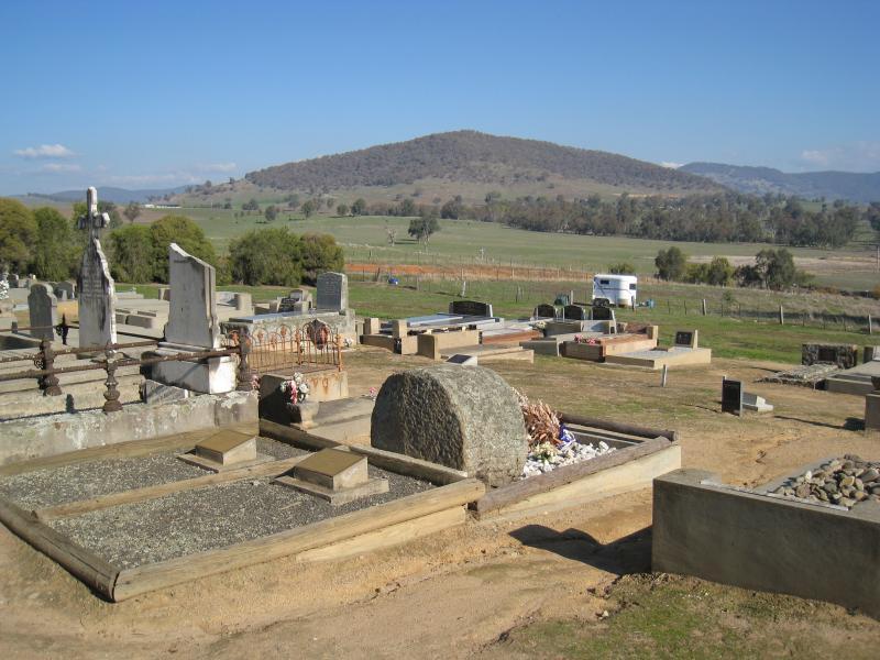 Corryong - Corryong cemetery and surroundings: Southerly view over back of Jack Riley's grave towards hills