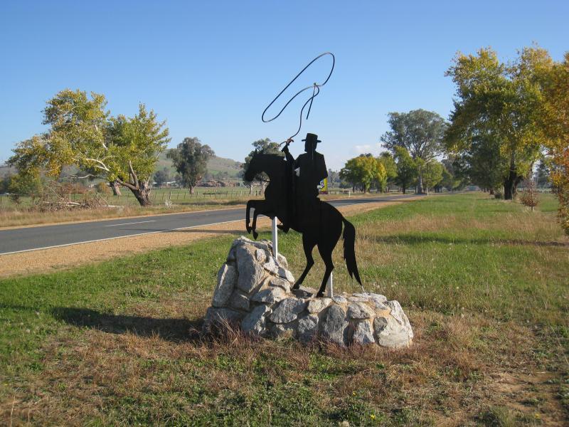 Corryong - Towong Road and Murray Valley Highway, east end of Corryong: Stockman monument, view south-west along Murray Valley Hwy, east of town