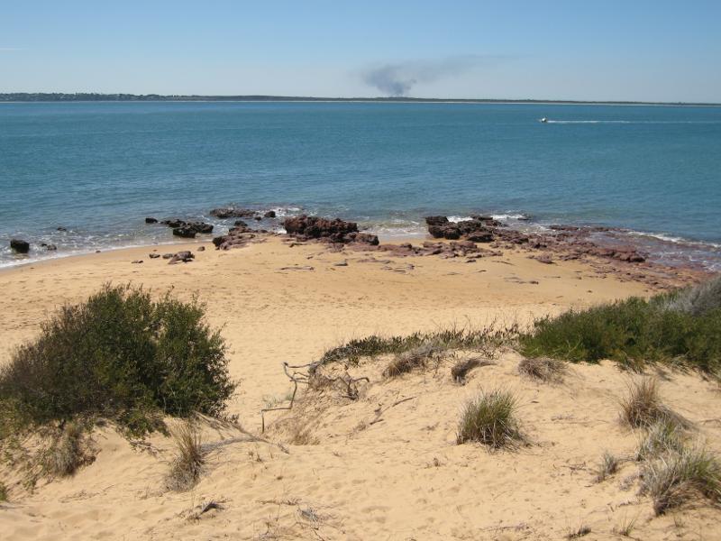Cowes - Red Rocks and Penguin Point at end of Red Rocks Road: View north across beach from top of sand dunes towards Mornington Peninsula