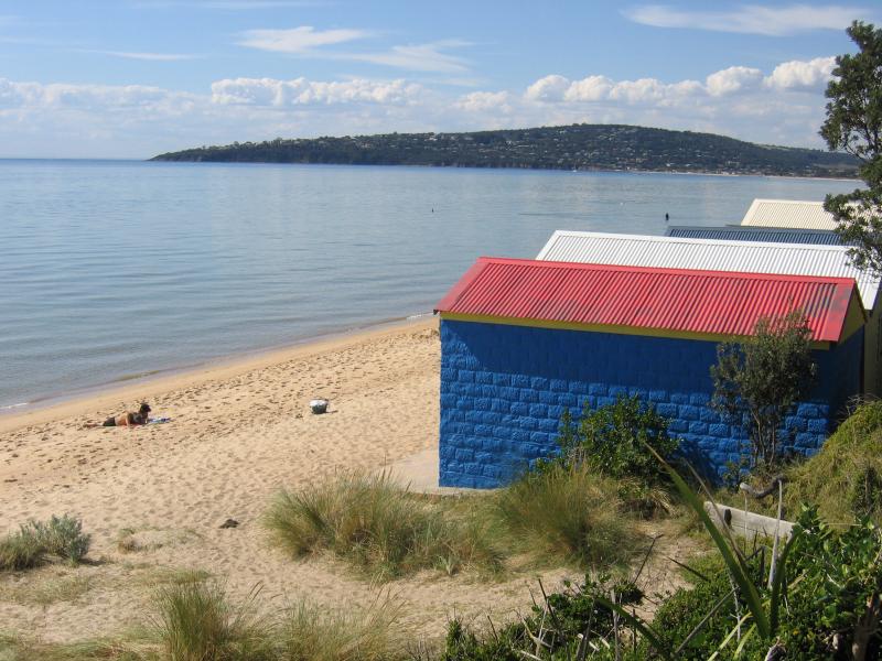Dromana - Coast near Dromana Pier and Dromana Foreshore Reserve: Bathing boxes, view north-east along coast near Kangerong Av with Mount Martha in background