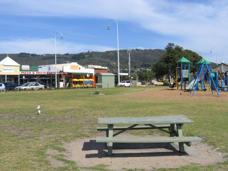 Dromana - Coast near Dromana Pier and Dromana Foreshore Reserve: View south-west along foreshore near pier towards shops on Point Nepean Rd