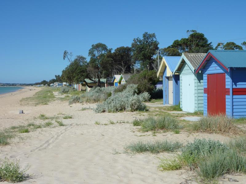 Dromana - Beach and foreshore around Latrobe Parade and information centre: Bathing boxes, view north-east along beach