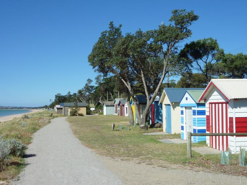 Dromana - Beach and foreshore around Latrobe Parade and information centre: View north-east along foreshore walking track in front of bathing boxes