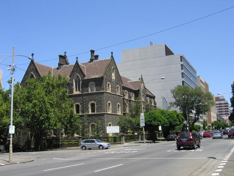 East Melbourne - Victoria Parade: Catholic College, view west along Victoria Parade at Eades St
