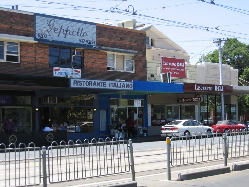 East Melbourne - Wellington Parade area: View east to shops along Wellington Parade near Simpson St