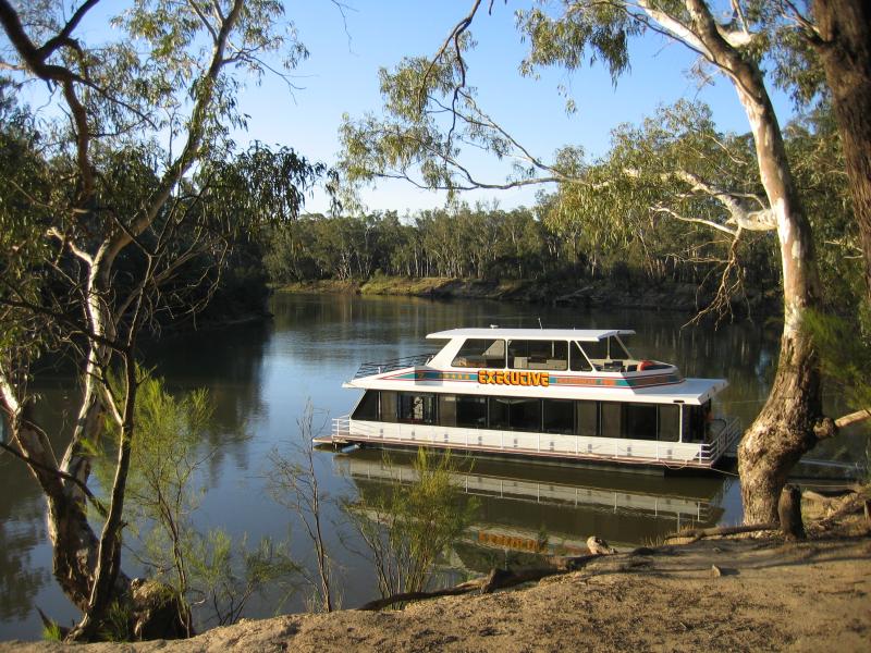 Echuca - Victoria Park, Scenic Drive and Murray River: A house boat moored on the Murray River, off Scenic Drive