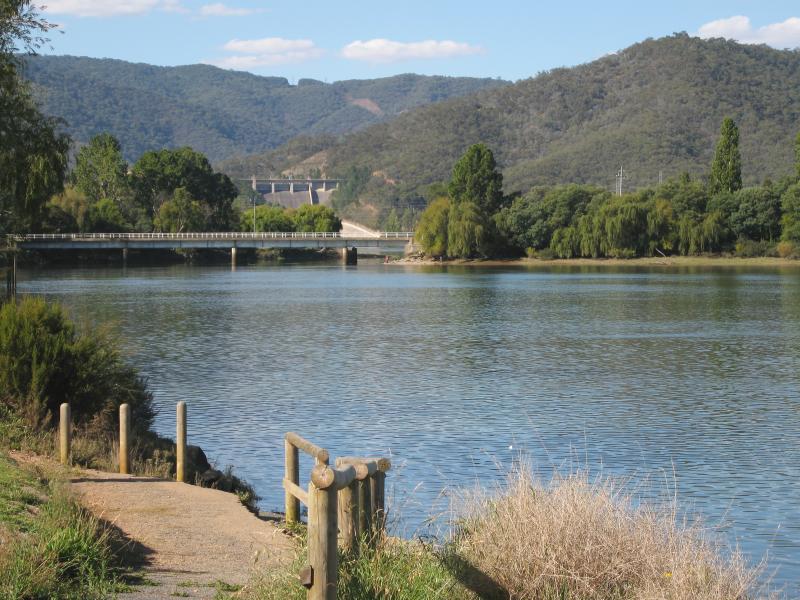 Eildon - Lions Riverside Park along Goulburn River at Riverside Drive: View north-east along river towards bridge and weir at spillway