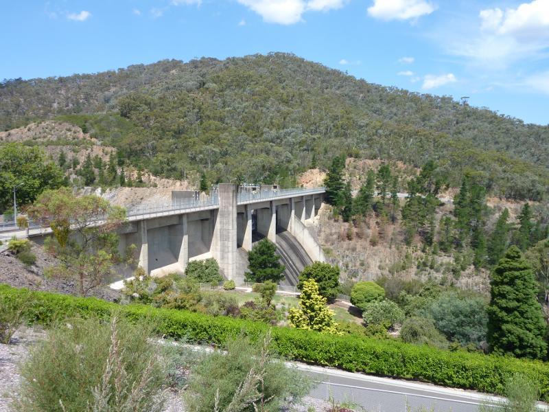 Eildon - Eastern end of Lake Eildon dam wall and lookout: View east towards weir at spillway from lookout