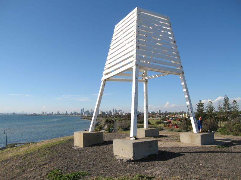 Elwood - Point Ormond Reserve and lookout at Point Ormond Hill: Navigation marker at Point Ormond Hill overlooking city skyline