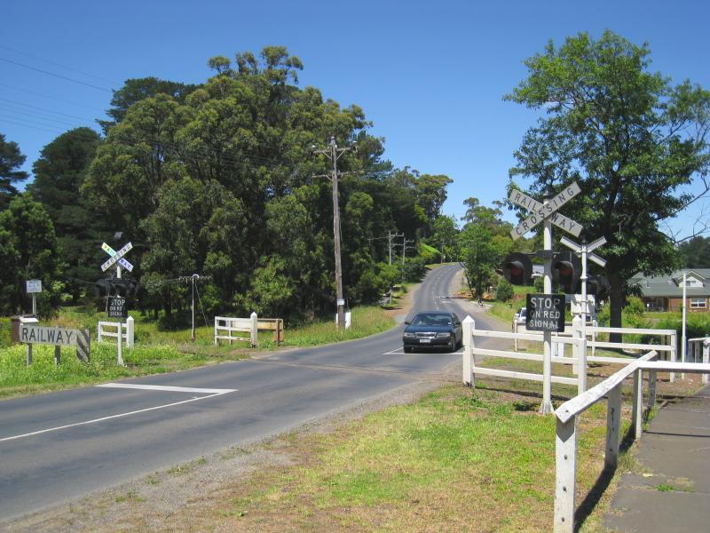 Emerald - Beaconsfield-Emerald Road and surroundings: View south-east along Beaconsfield-Emerald Rd at Puffing Billy railway crossing