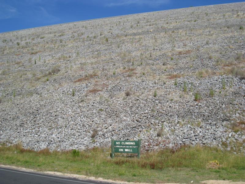 Emerald - Cardinia Reservoir Park: View of dam wall from road along base near Kangaroo Flat Picnic Area