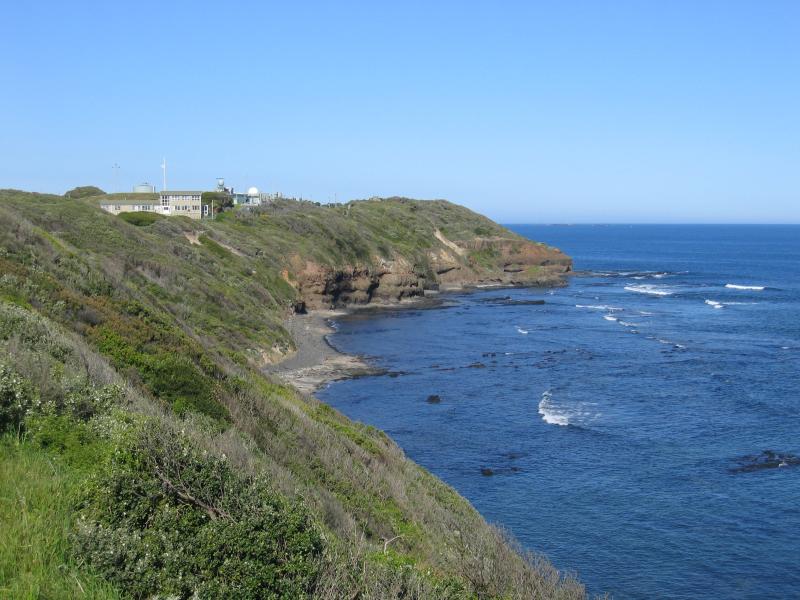 Flinders - Coast along Bass Strait and Ocean Beach: View east along coast from lookout towards Navy Training Facility and West head
