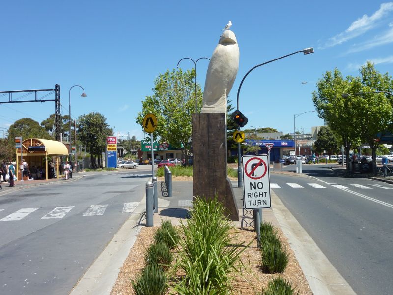 Frankston - Shops and commercial centre between Nepean Highway and Young Street: View south along Young St at Wells St towards Sentinel sea eagle sculpture