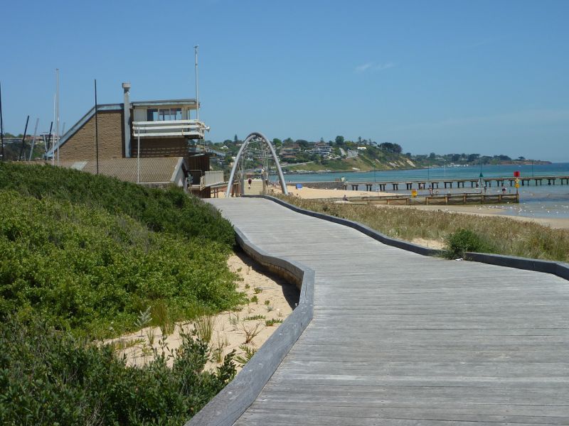 Frankston - Beach between Frankston Life Saving Club and Kananook Creek: View south along coastal boardwalk towards Frankston Life Saving Club