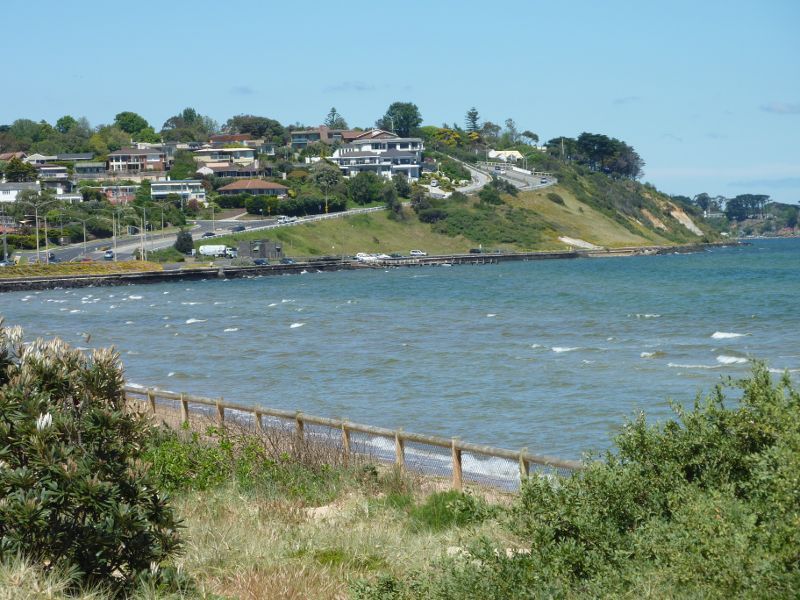 Frankston - Foreshore boardwalk and beach south of Frankston Pier - View across foreshore and bay towards Olivers Hill