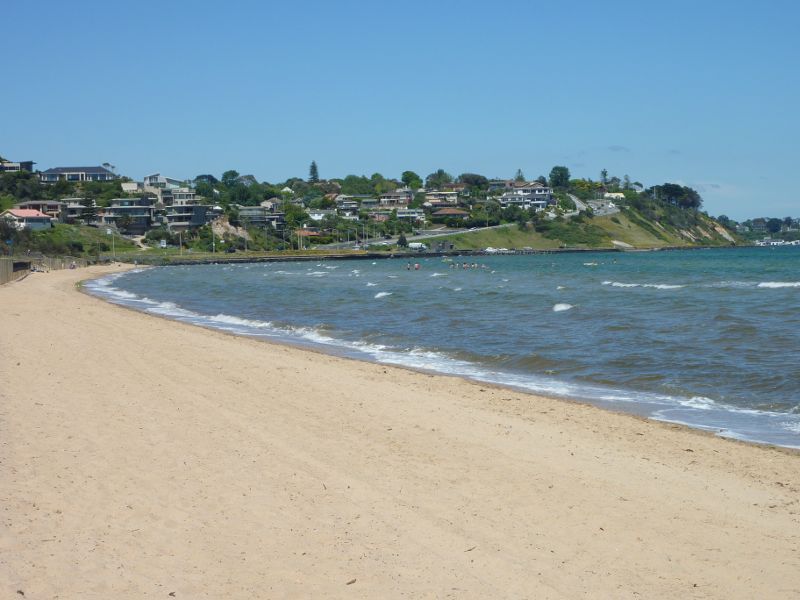 Frankston - Foreshore boardwalk and beach south of Frankston Pier: View across beach towards Olivers Hill