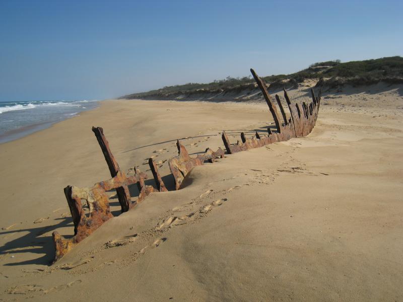 Golden Beach - Trinculo ship wreck on the beach, 6&frac12; kilometres south-west of town centre: View south-west along beach at ship wreck