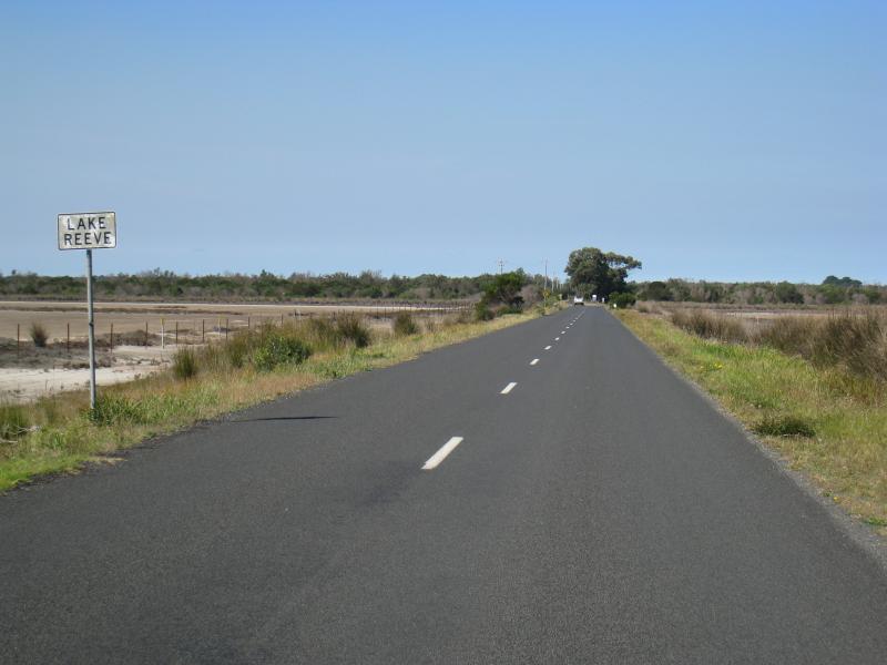 Golden Beach - Lake Reeve (usually dry) at Longford-Golden Beach Road: View south-east along Longford Rd towards Lake Reeve